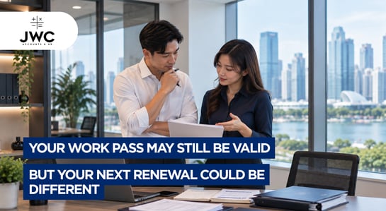 Singapore employer reviewing work pass renewal documents with a professional work pass consultant  