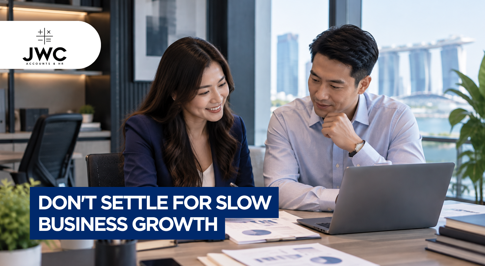 Singapore SME business owner reviewing an accounting backlog and financial documents at a desk